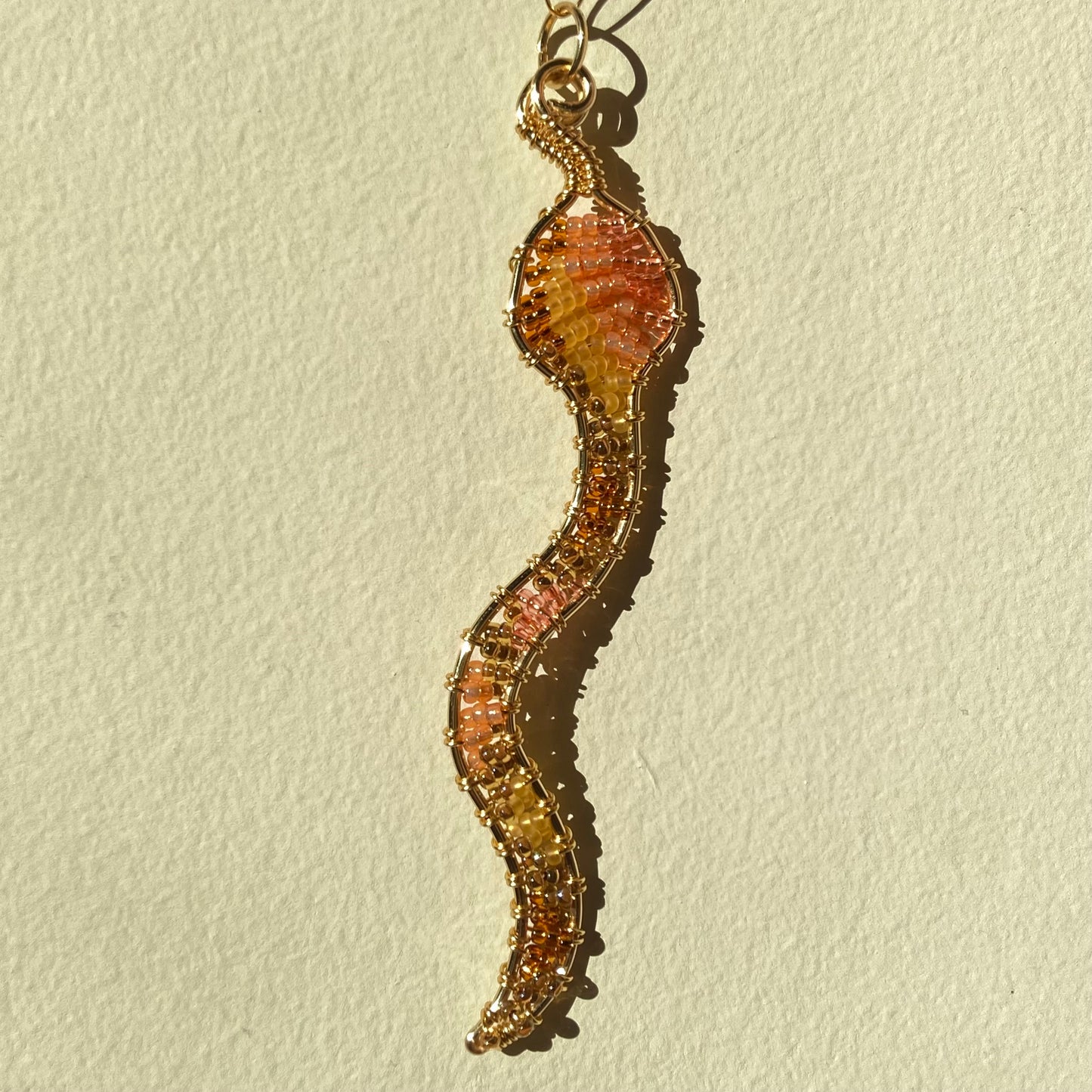 Brown Sugar Peach Snake Beaded Pendants
